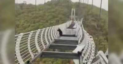 Man Left Dangling 330ft Mid Air As Glass Bridge In China Is Damaged By Strong Winds