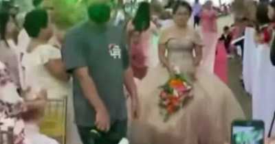 Wedding Planner Hides Under Bride's Gown To Help Her Walk Amid The Strong Winds
