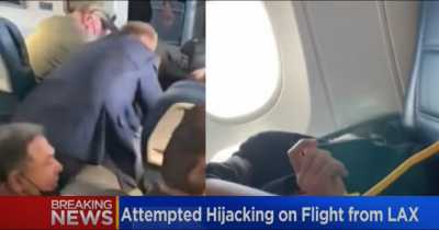 Man Allegedly Trying To Hijack Plane Tackled By Crew And Passengers As He Tries To Exit Through The Emergency Door.