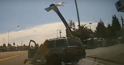 Enraged Man Throws Pickaxe At Windshield