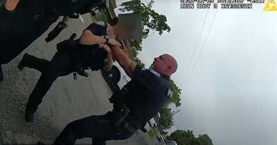 Cop Grabs Female Officer's Throat And Shoves Her After She Tried To Pull Him Off A Suspect