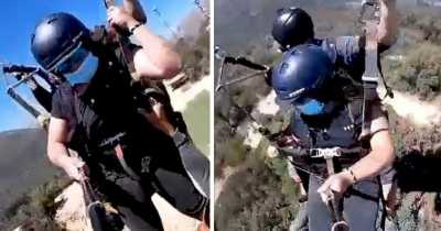 Man Is Left Dangling From A Paraglider By His Hands As It Soars Hundreds Of Feet Into The Air