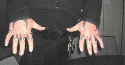 Cincinnati Police Officer Fired For Getting 'Pure Evil' Tattoo On His Knuckles