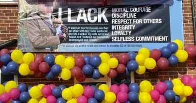 Angry Army Wife Exposes Cheating Husband By Putting Up A Banner Outside Home