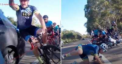 Dangerous Moment A Group Of Cyclists Crash Into Each Other When A Car Passes Too Close