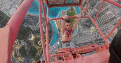 Free Climber Realises Crane Is Covered In Grease After Scaling 1,200ft Above Dubai