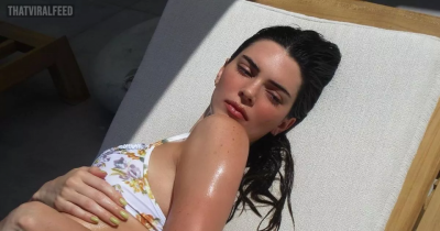 Kendall Jenner Makes "CHEEKY" Display In PVC Leather Thong And Fishnet Stockings
