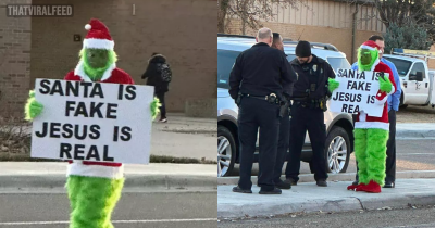 Grinch Stands Outside Elementary School Scaring Children With &lsquo;Santa Is Fake&rsquo; Sign
