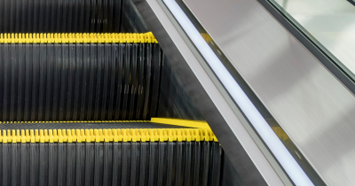Surprising Reason Escalators Have Those Brushes On The Sides